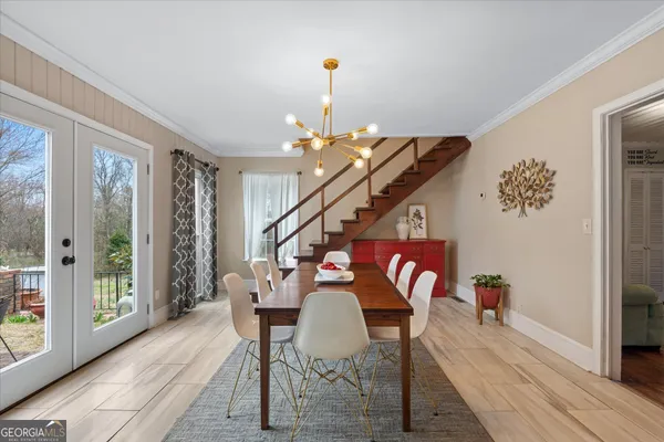 a open kitchen with white cabinets and stainless steel appliances