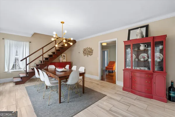 a kitchen with stainless steel appliances kitchen island a stove a sink a refrigerator and cabinets