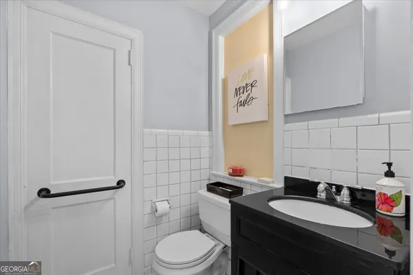 a spacious bathroom with a double vanity sink and a mirror