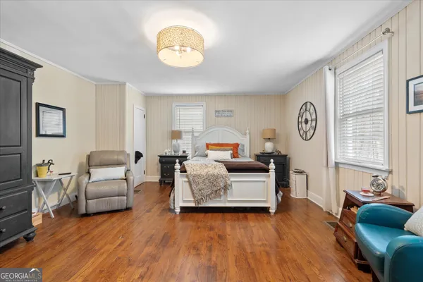 a bedroom with a bed and window