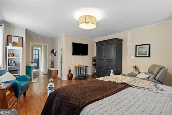 a view of a room with cabinet and wooden floor