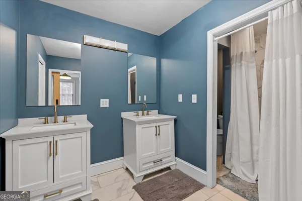 a bathroom with a toilet and a sink