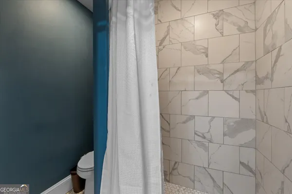 a bathroom with a mirror and a sink
