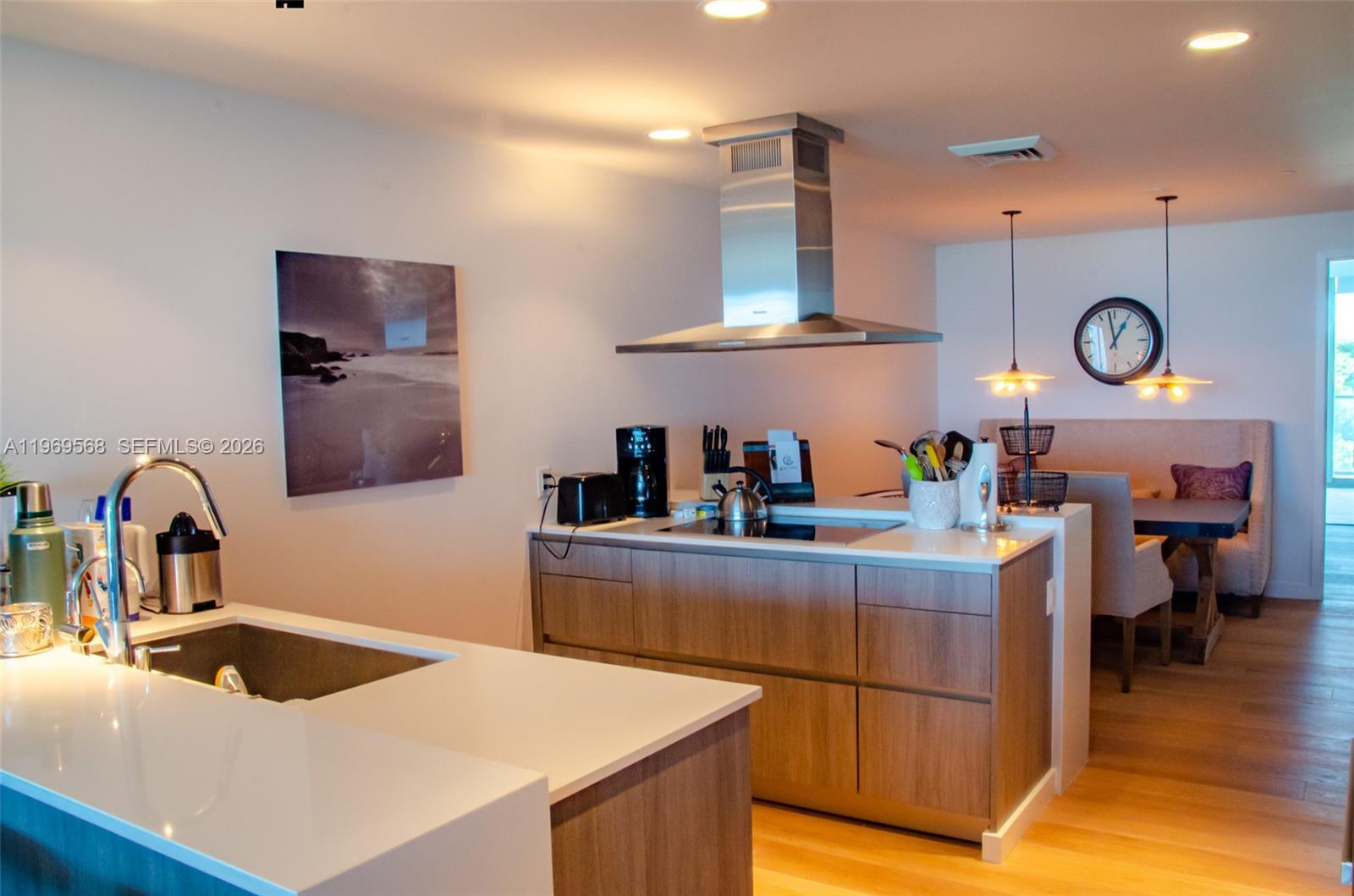 350 Ocean Drive, Unit 406N Key Biscayne, FL 33149 - Photo 14 of 41 a kitchen with a refrigerator and a sink