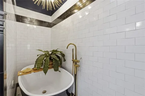 a bathroom with a sink and mirror