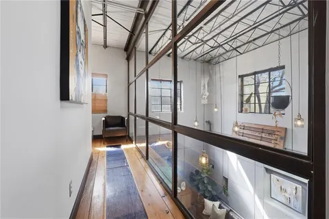 a view of a room with furniture and a window