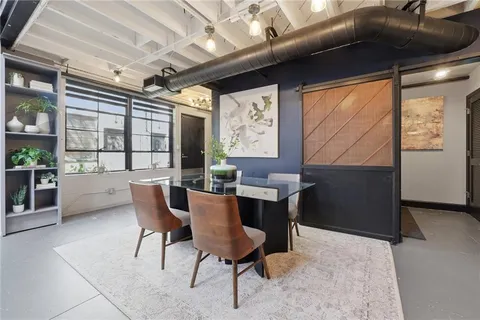 a dining room with furniture and window