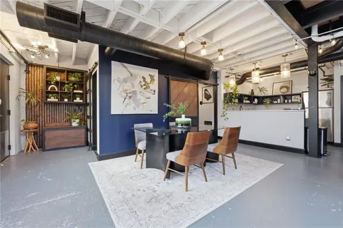 a dining room with furniture and window