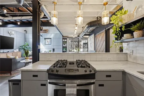 a kitchen with a stove and a sink