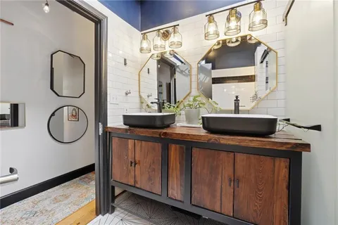 a bathroom with a sink and a mirror