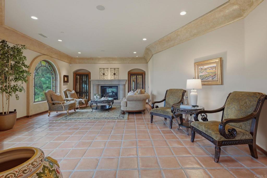 3244 Olivenhain Farms Road Encinitas, CA 92024 - Photo 7 of 47 a living room with furniture and a fireplace