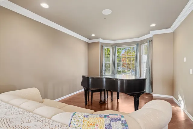 a bedroom with furniture and a window