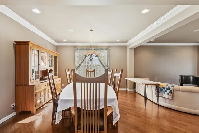 a view of a livingroom with furniture wooden floor and front door