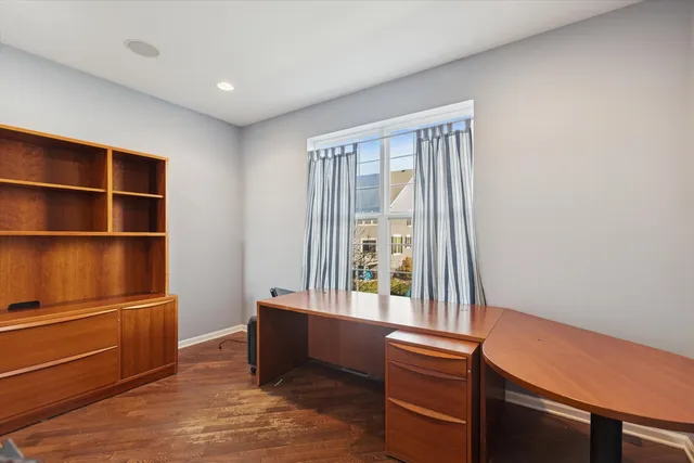 a view of room with window and wooden floor