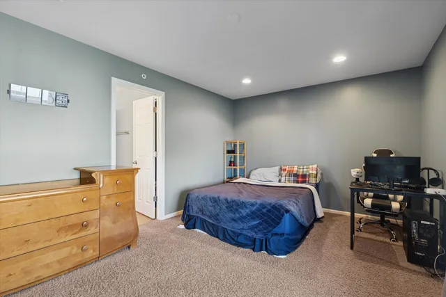 a bedroom with a bed and furniture