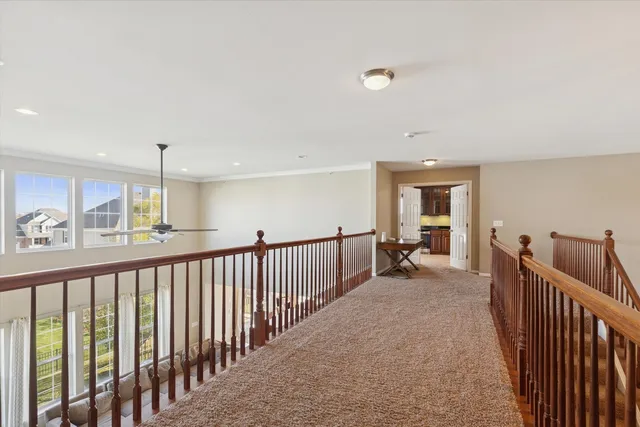 a view of a hallway with windows