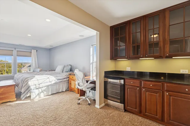 a bed room with a bed and furniture