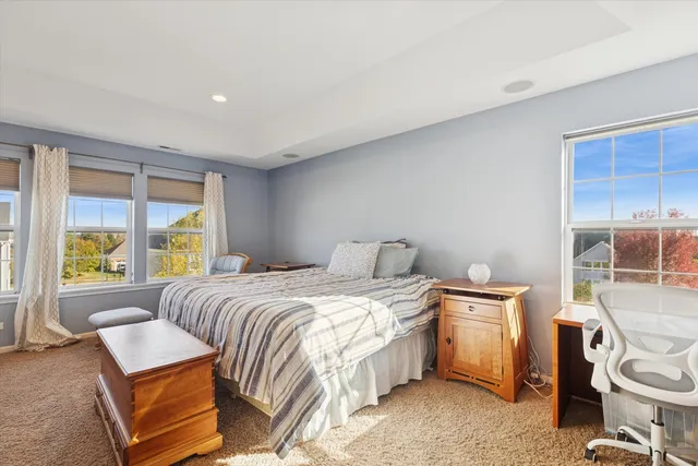 a bed room with a bed and a window