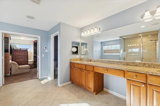 a large bathroom with a large tub and sink
