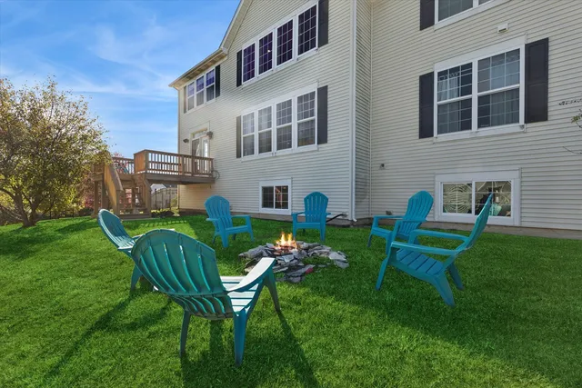 a view of a house with a yard porch and sitting area