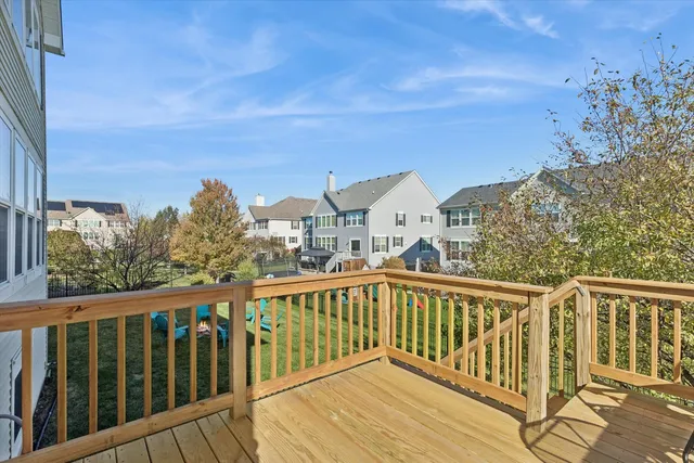 a view of a balcony with wooden floor and city view