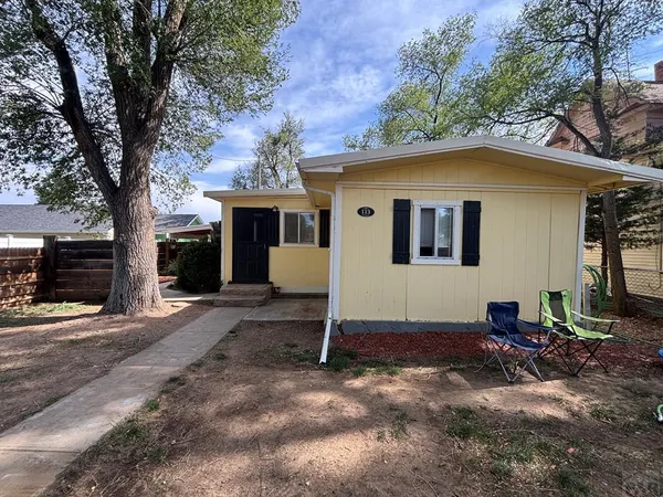 a view of house with yard and entertaining space