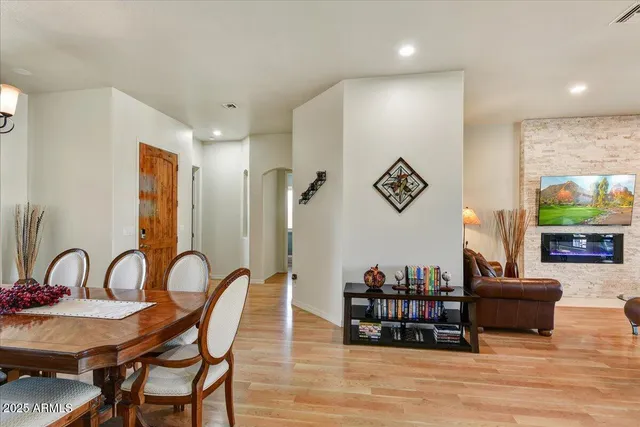 a living room with furniture and a lamp