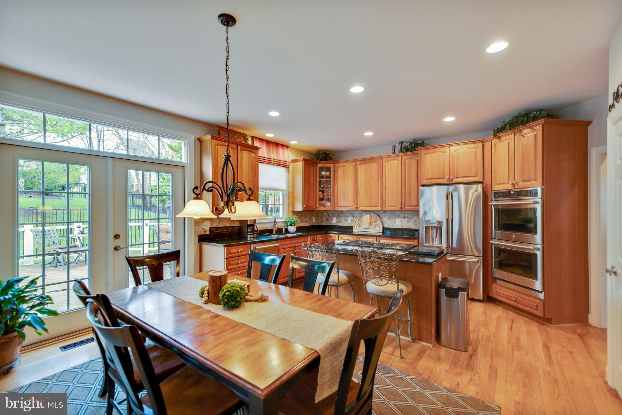 8347 Roxborough Loop Gainesville, VA 20155 - Photo 11 of 52 Eat in kitchen with double French doors
