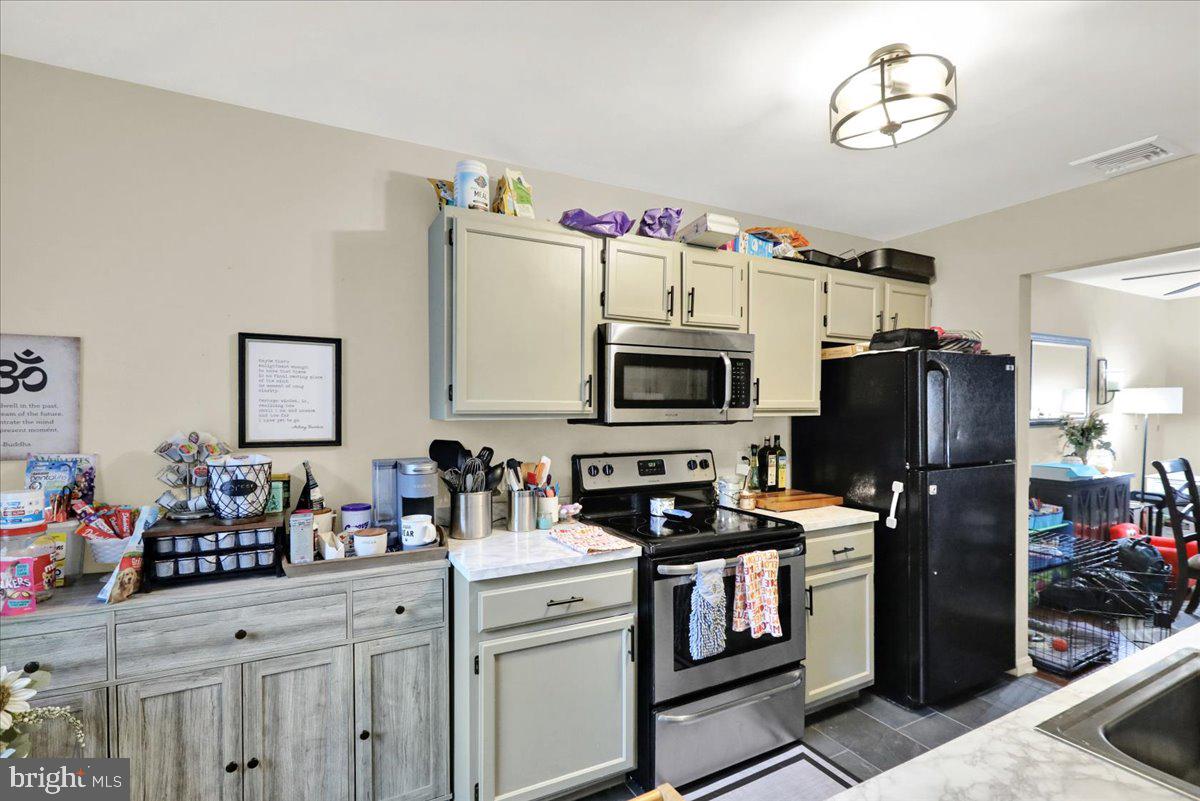 120 Laurel Court Reading, PA 19610 - Photo 11 of 21 a kitchen with a sink stainless steel appliances and white cabinets