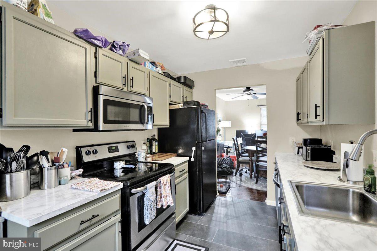 120 Laurel Court Reading, PA 19610 - Photo 10 of 21 a kitchen with stainless steel appliances granite countertop a sink dishwasher stove and refrigerator