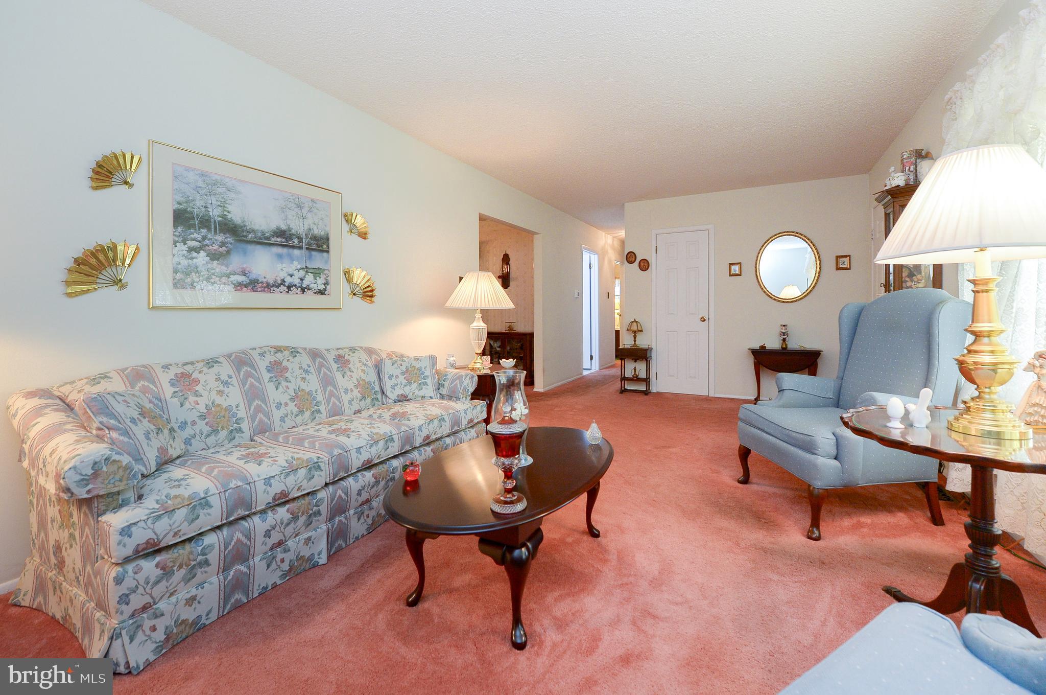 437 Cedar Lane Mickleton, NJ 08056 - Photo 12 of 29 a living room with furniture and a clock