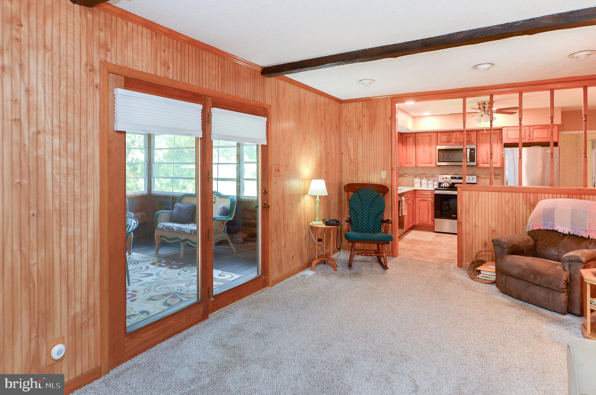 437 Cedar Lane Mickleton, NJ 08056 - Photo 17 of 29 a living room filled with furniture and a floor to ceiling window