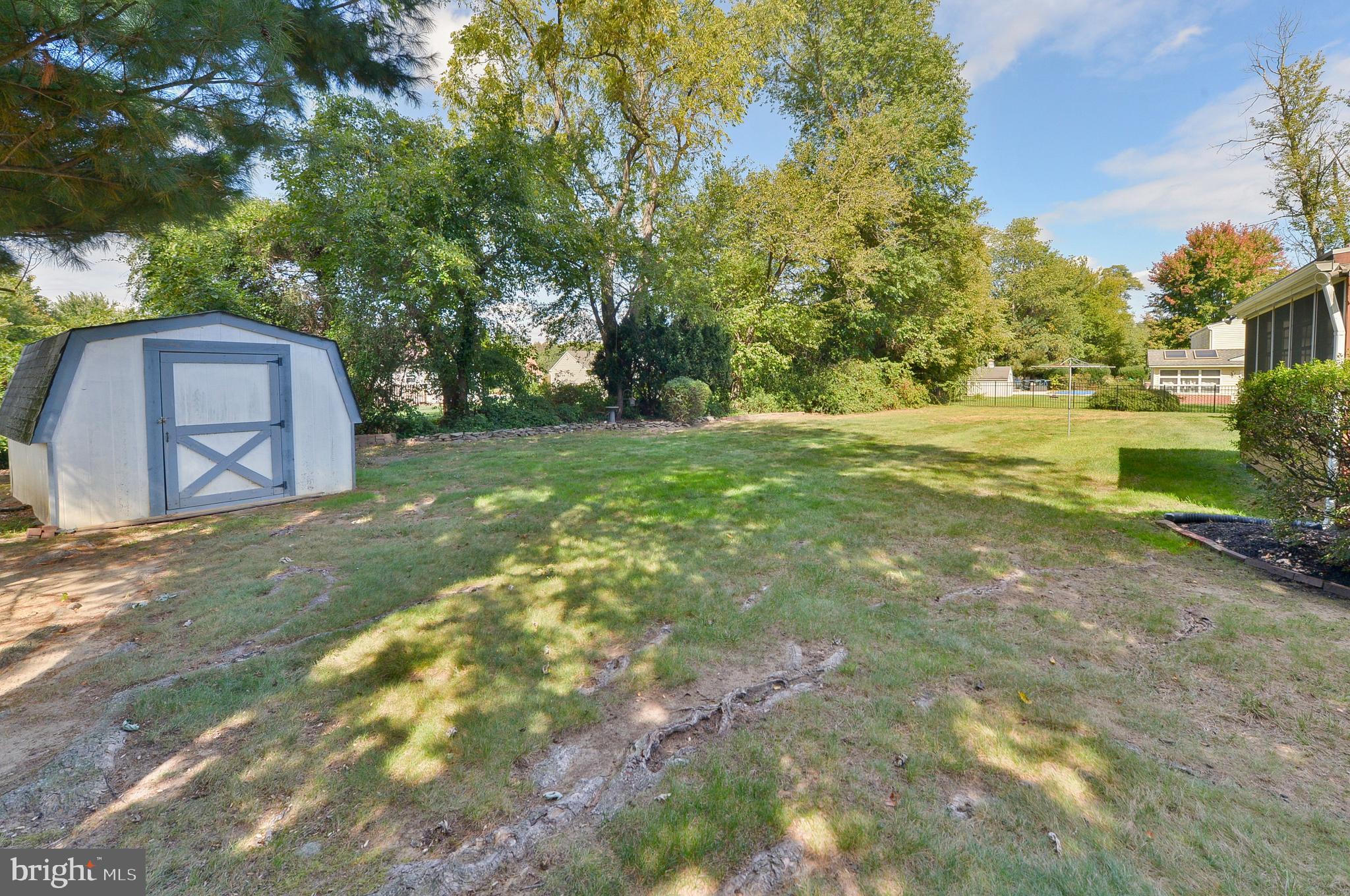 437 Cedar Lane Mickleton, NJ 08056 - Photo 6 of 29 a view of a backyard with large trees