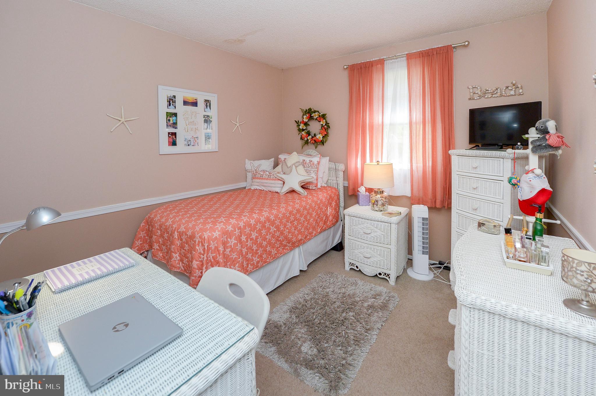 437 Cedar Lane Mickleton, NJ 08056 - Photo 8 of 29 a bedroom with a bed and a flat screen tv