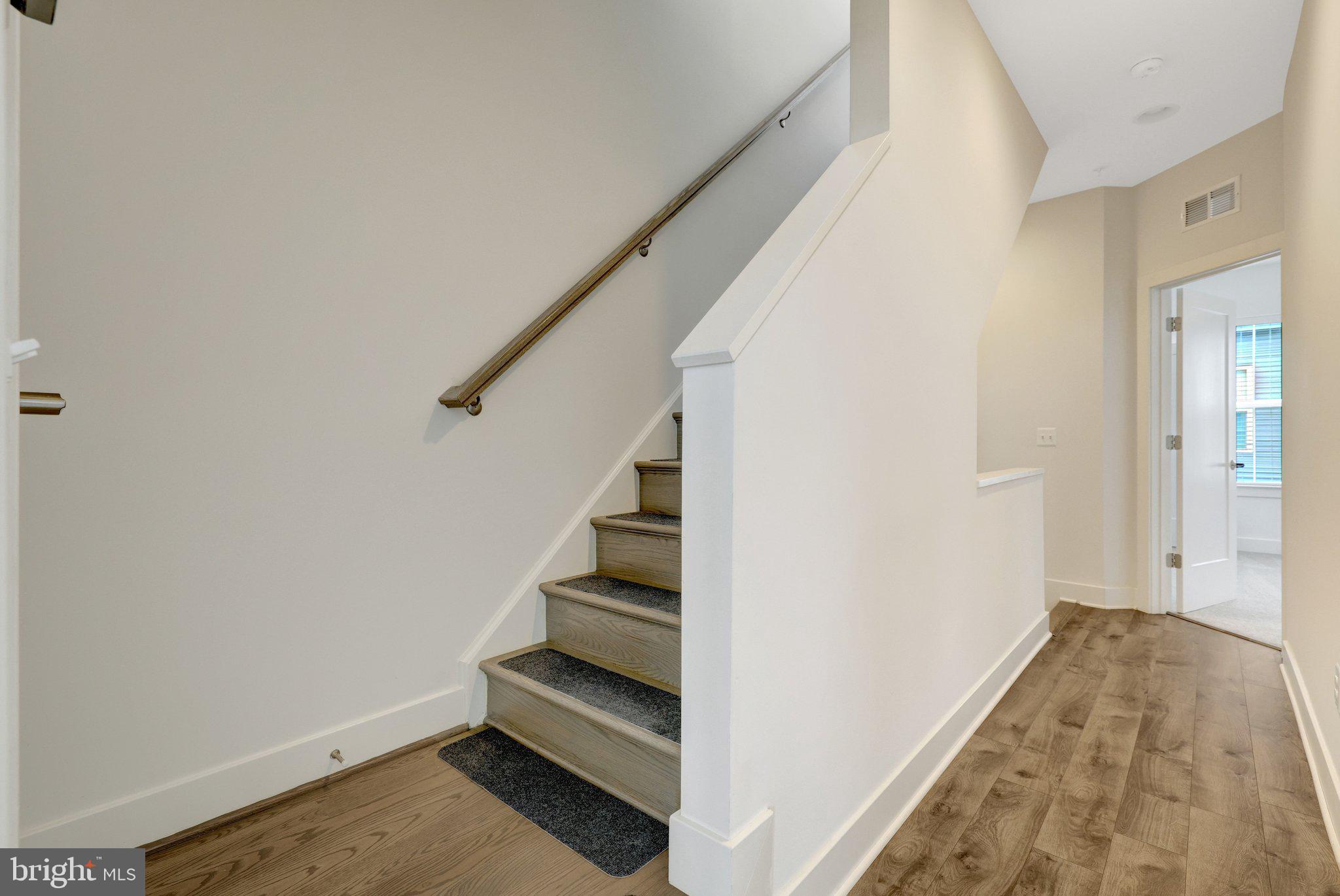 11247 Beaker Street Reston, VA 20190 - Photo 28 of 54 Inviting staircase to modern living.
