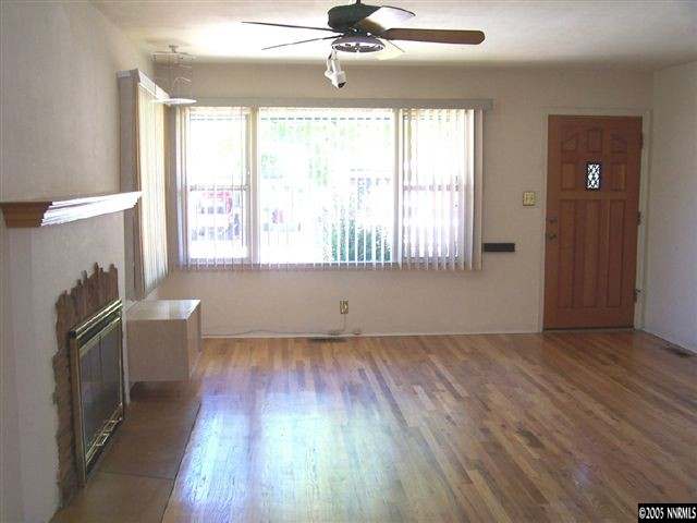 675 Candy Avenue Reno, NV 89509 - Photo 2 of 8 wooden floor in an empty room with a window