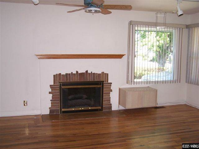 675 Candy Avenue Reno, NV 89509 - Photo 3 of 8 a living room with furniture and a fireplace