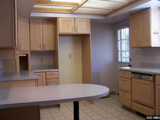 675 Candy Avenue Reno, NV 89509 - Photo 5 of 8 a kitchen with a sink cabinets and wooden floor