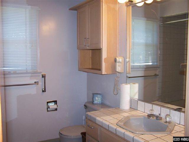 675 Candy Avenue Reno, NV 89509 - Photo 6 of 8 a bathroom with a sink and a toilet