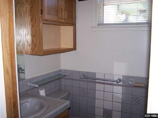 675 Candy Avenue Reno, NV 89509 - Photo 7 of 8 a bathroom with a sink and a toilet