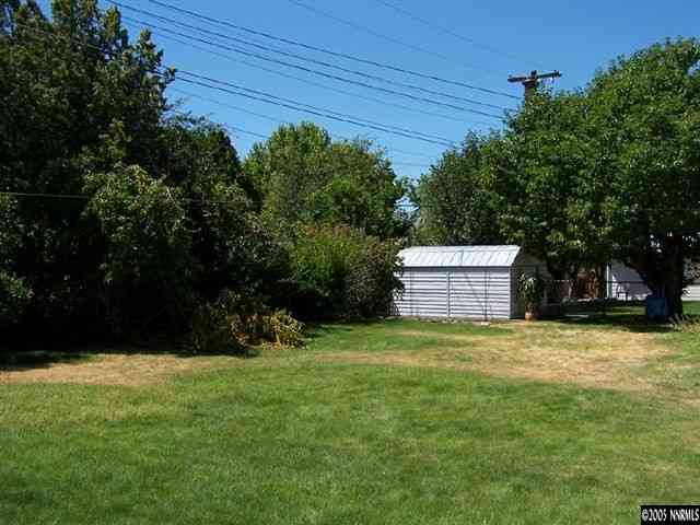 675 Candy Avenue Reno, NV 89509 - Photo 8 of 8 a backyard of a house with plants and trees