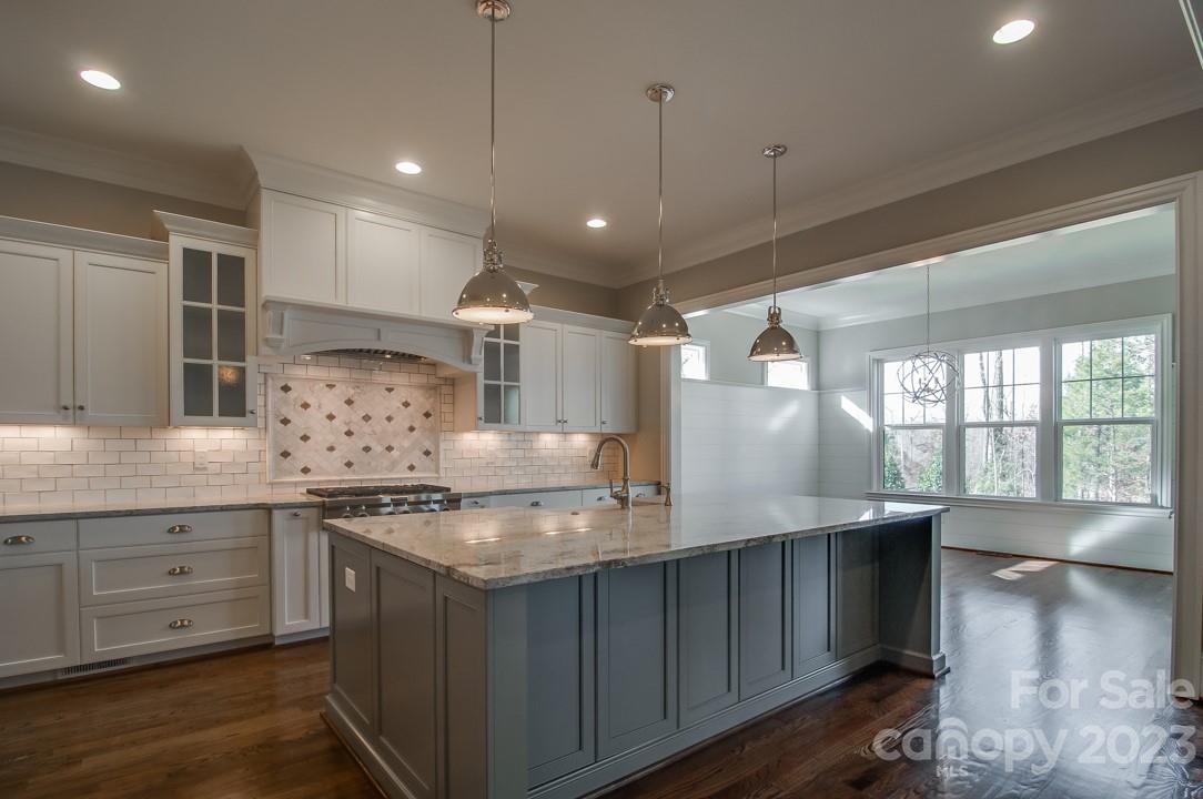 2837 Holbrook Road, Unit 26 Fort Mill, SC 29715 - Photo 4 of 14 a kitchen with stainless steel appliances granite countertop a sink a stove and a wooden floors