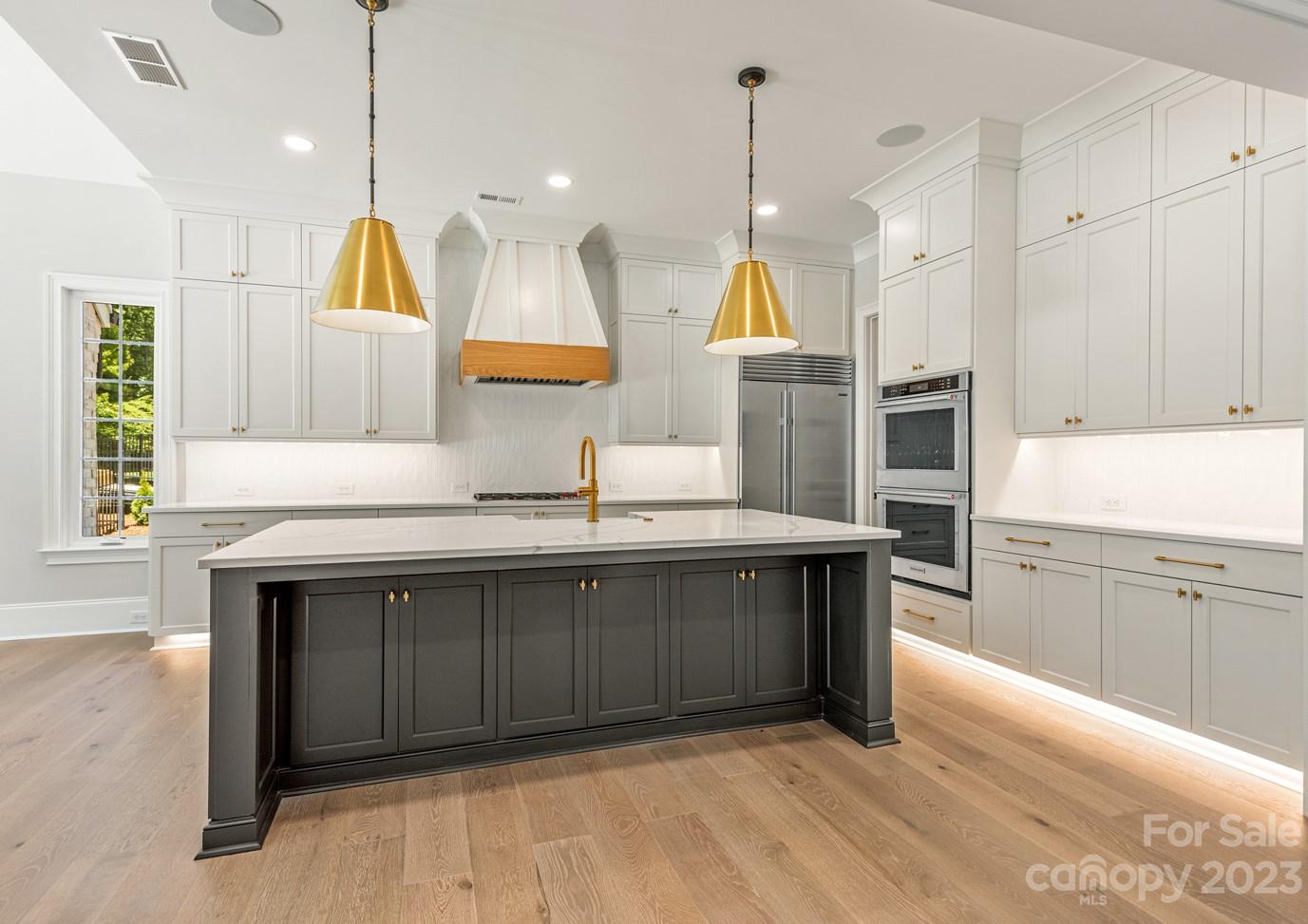 2837 Holbrook Road, Unit 26 Fort Mill, SC 29715 - Photo 6 of 14 a kitchen with kitchen island a sink a stove and a window
