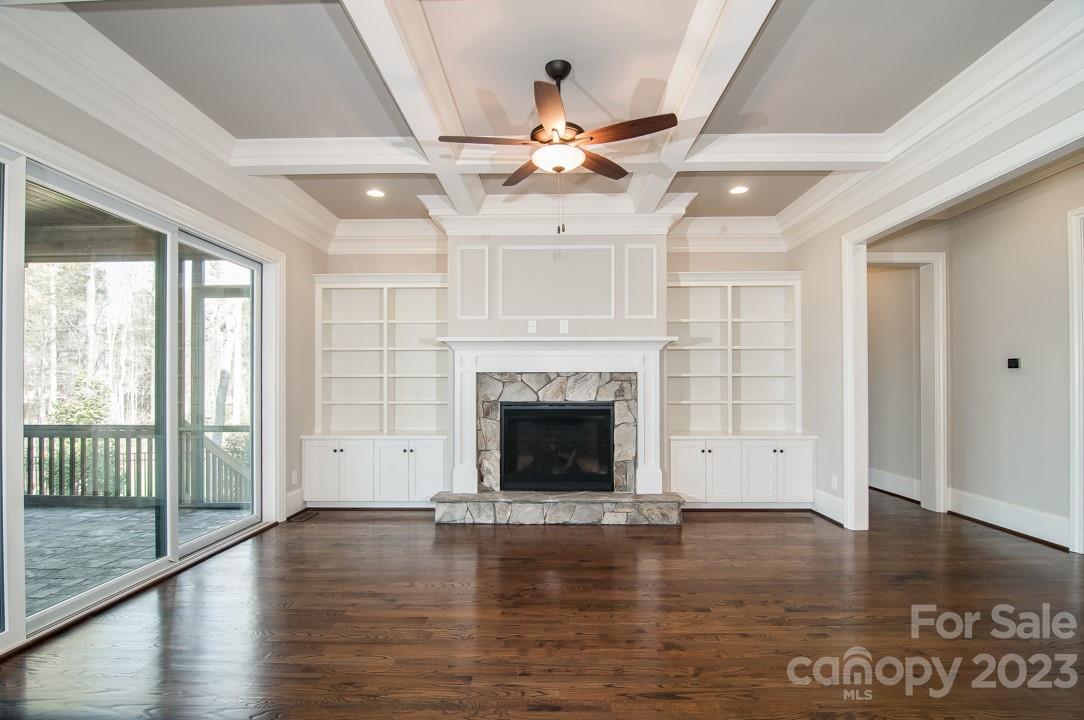 2837 Holbrook Road, Unit 26 Fort Mill, SC 29715 - Photo 9 of 14 a view of empty room with wooden floor and fireplace