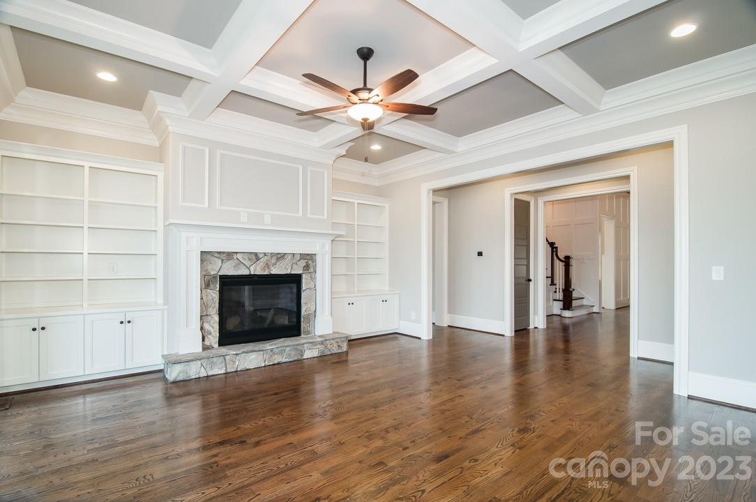 2837 Holbrook Road, Unit 26 Fort Mill, SC 29715 - Photo 10 of 14 a view of an empty room with wooden floor fireplace and a window