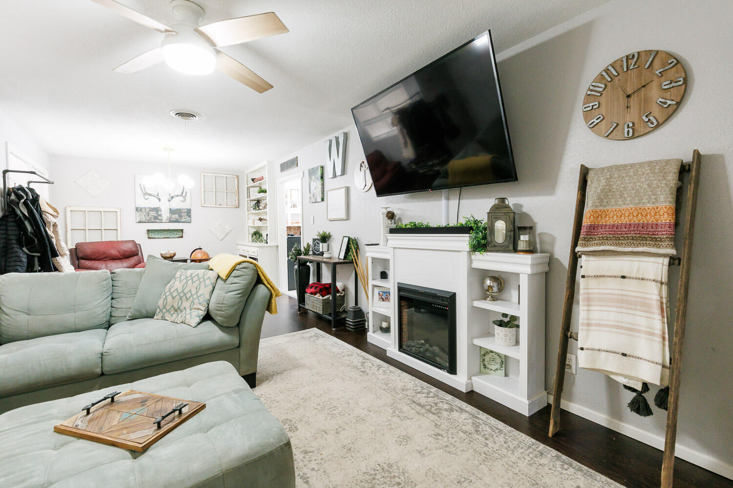 2718 55th Street Lubbock, TX 79413 - Photo 11 of 58 a living room with furniture a flat screen tv and a fireplace