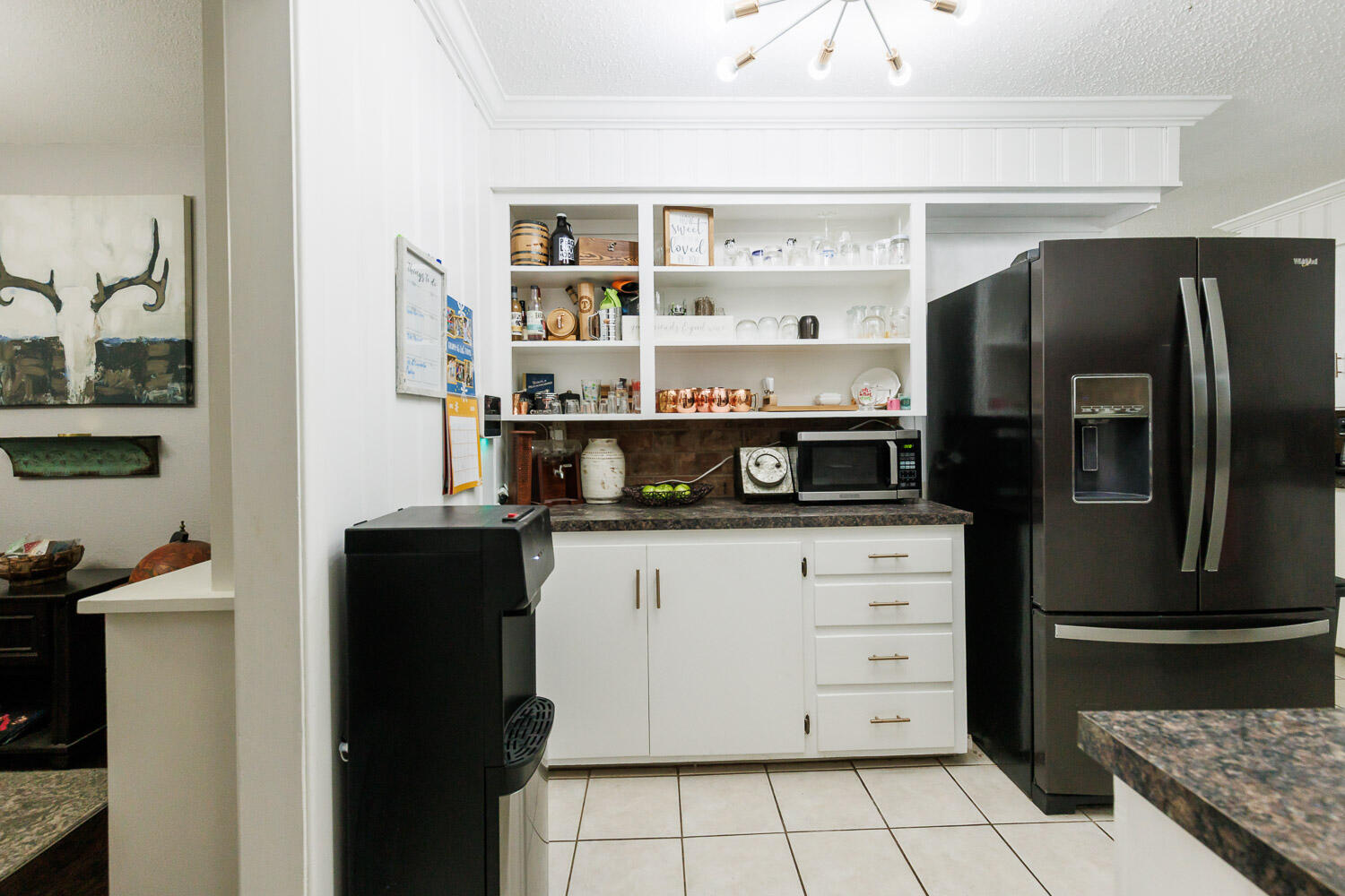 2718 55th Street Lubbock, TX 79413 - Photo 14 of 58 a kitchen with stainless steel appliances granite countertop a refrigerator and a stove