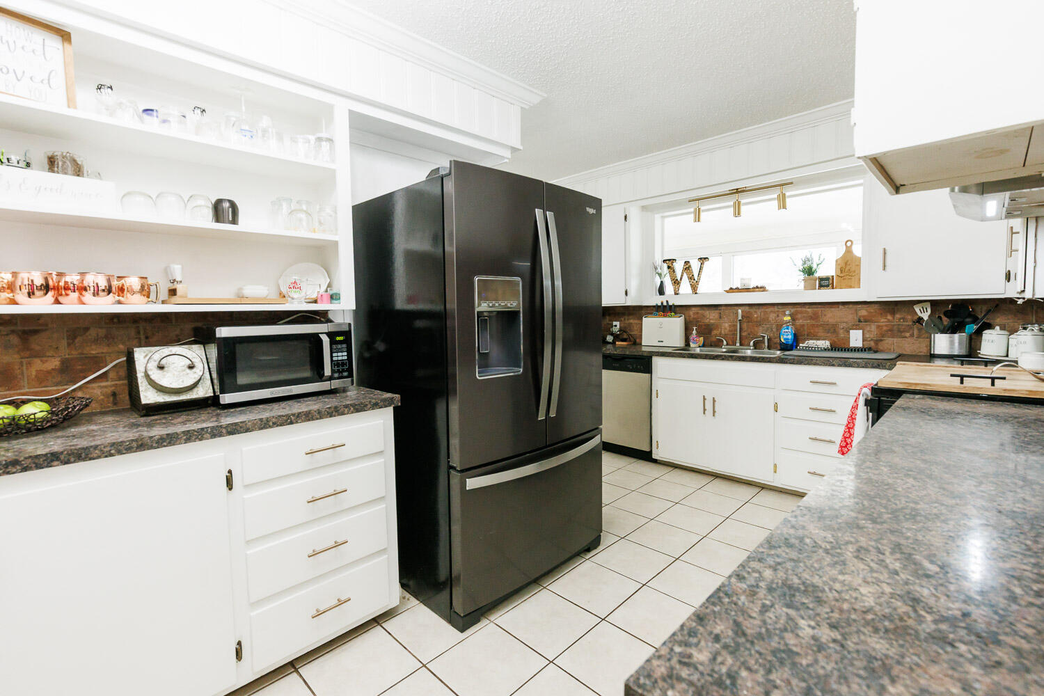 2718 55th Street Lubbock, TX 79413 - Photo 15 of 58 a kitchen with stainless steel appliances granite countertop a refrigerator a stove a sink and a refrigerator