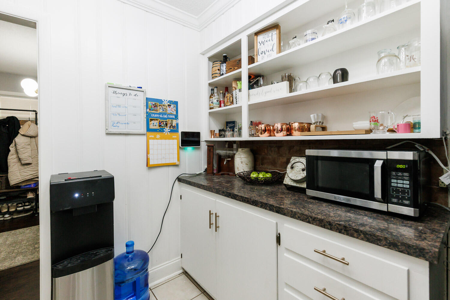 2718 55th Street Lubbock, TX 79413 - Photo 16 of 58 a kitchen with granite countertop a stove and cabinets