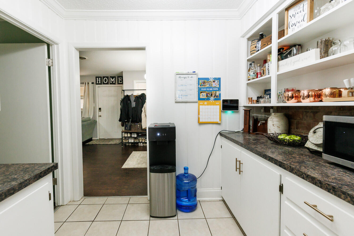 2718 55th Street Lubbock, TX 79413 - Photo 17 of 58 a kitchen with granite countertop a refrigerator and a sink